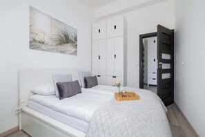 1 bedroom, desk, iron/ironing board, travel crib