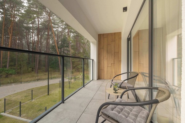 Pleasant balcony with garden furniture.