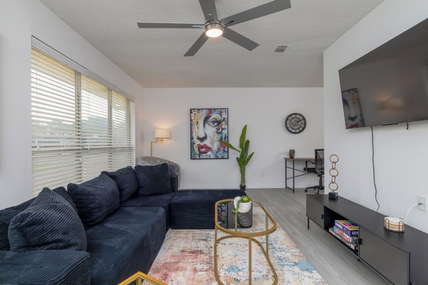 Spacious living room with plenty of seating for friends and family.