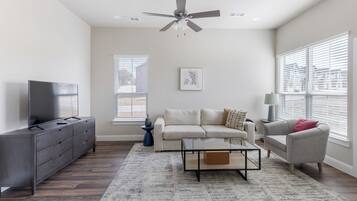 Apartment, 3 Bedrooms | Living area | 50-inch TV with digital channels