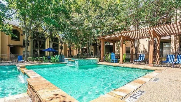 A pool area with two pools, a pergola, and outdoor seating. - Boulevard Stays Calm 1BR King Retreat Poolside Bliss Gym & Parking (Arlington)
