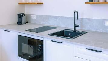 Fridge, microwave, stovetop, coffee/tea maker