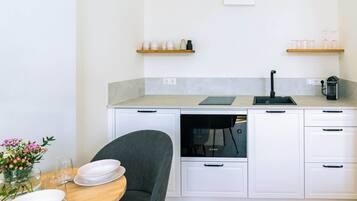 Fridge, microwave, stovetop, coffee/tea maker