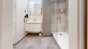 Shower, hair dryer, towels, soap