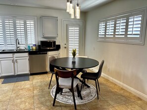 Kitchen dining area with access to backyard 
