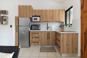 Fridge, microwave, stovetop, coffee/tea maker