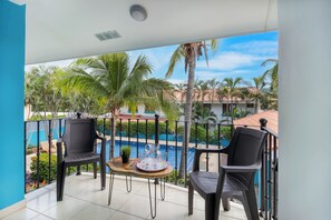 Terrace/patio - Sun-Kissed 2BR Oasis — A Pool & 5-Min to the Beach (Coco)