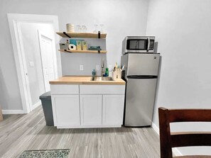 Fridge, microwave, stovetop, coffee/tea maker