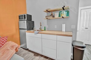 Fridge, microwave, stovetop, coffee/tea maker