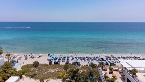 On the beach, sun loungers, beach towels