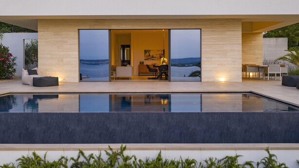 A modern house with a pool, a dining area, and a view of the sea. - Awesome home in Tkon with private swimming pool, can be inside or outside (Tkon)