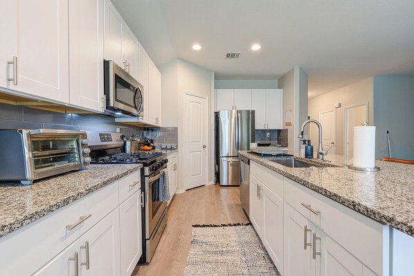 Microwave, oven, stovetop, dishwasher - Family-Friendly 3BR Home w/ Teepee Sleepover Setup + Backyard Fun! (Magnolia)