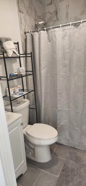 Hair dryer, towels, soap, toilet paper