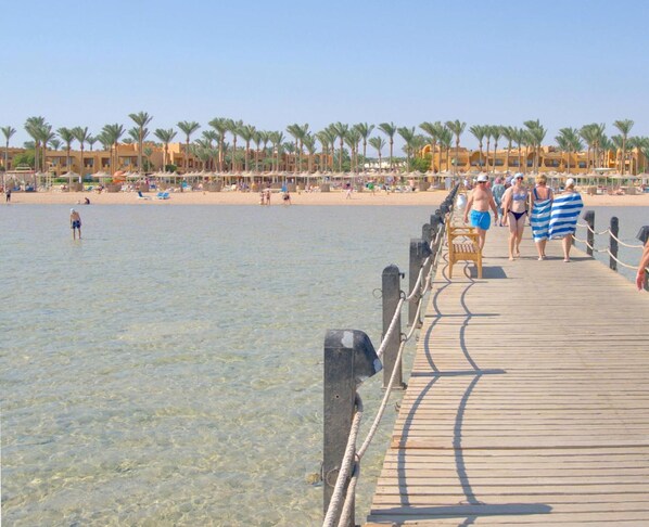 On the beach, sun loungers, beach towels