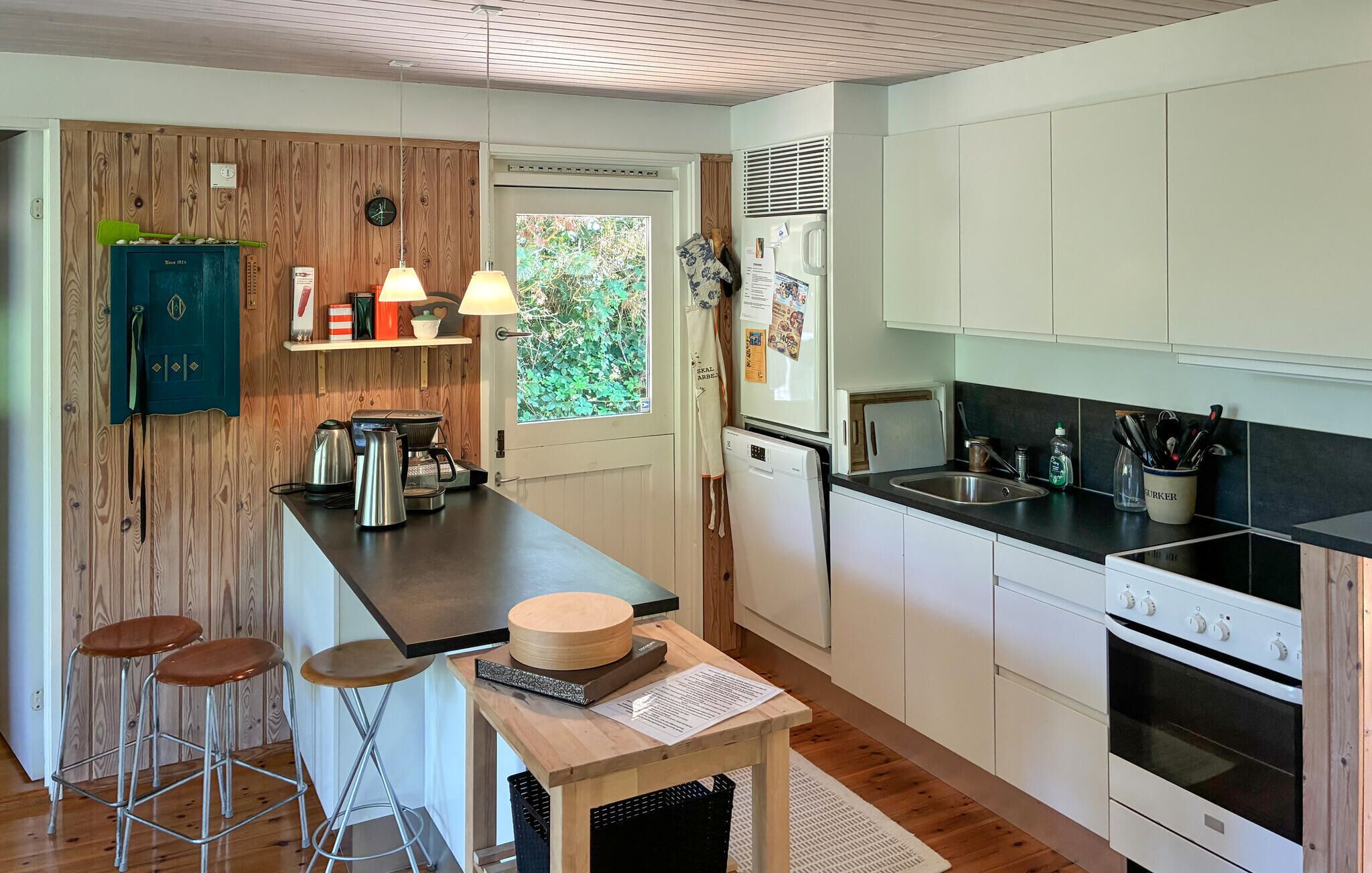 Fridge, stovetop, dishwasher, coffee/tea maker