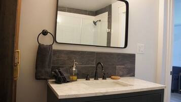 Shower, towels, soap, toilet paper