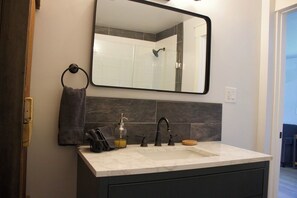 Shower, towels, soap, toilet paper