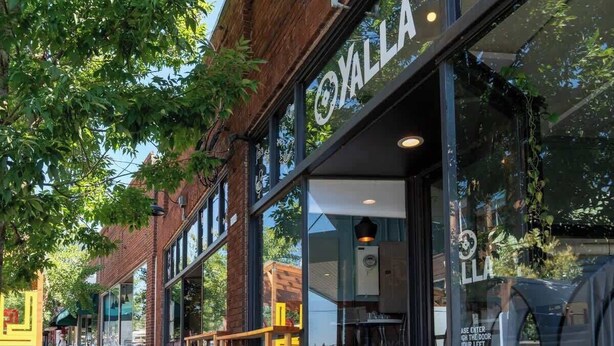A storefront with a large sign reading "YALLA" and a window displaying a menu. - Forest Studio Oasis - Mile from Multnomah Village (Portland)