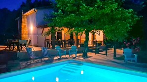 An outdoor pool area with lounge chairs and a dining area with tables and chairs. - Gorgeous home in Balazuc with private swimming pool, can be inside or outside (Balazuc)