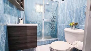Shower, towels, soap, toilet paper