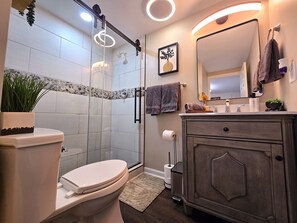 Shower, hair dryer, towels, soap