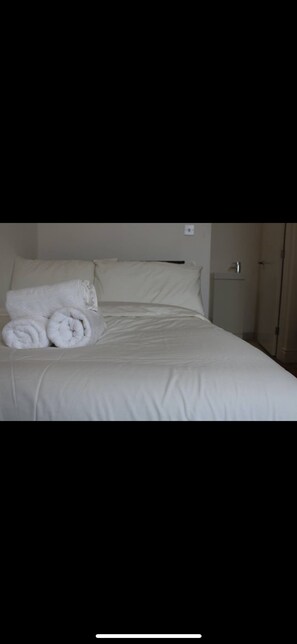 Desk, laptop workspace, blackout curtains, free WiFi