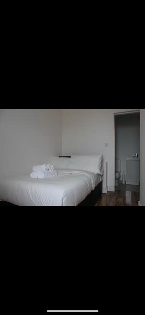 Desk, laptop workspace, blackout curtains, free WiFi