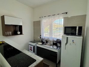 Microwave, stovetop - Cozy house in Polvilho Cajamar, just a few minutes from Rod. Anhanguera (Jardim Santana Cajamar)