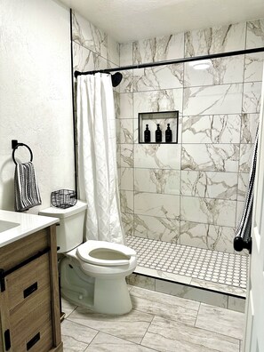 Hair dryer, towels, soap, toilet paper