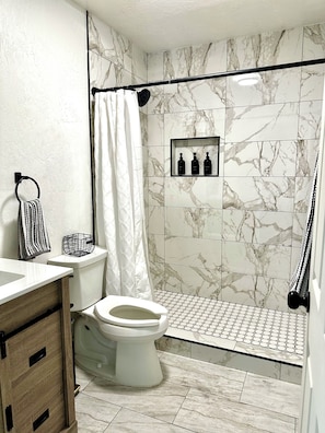 Hair dryer, towels, soap, toilet paper