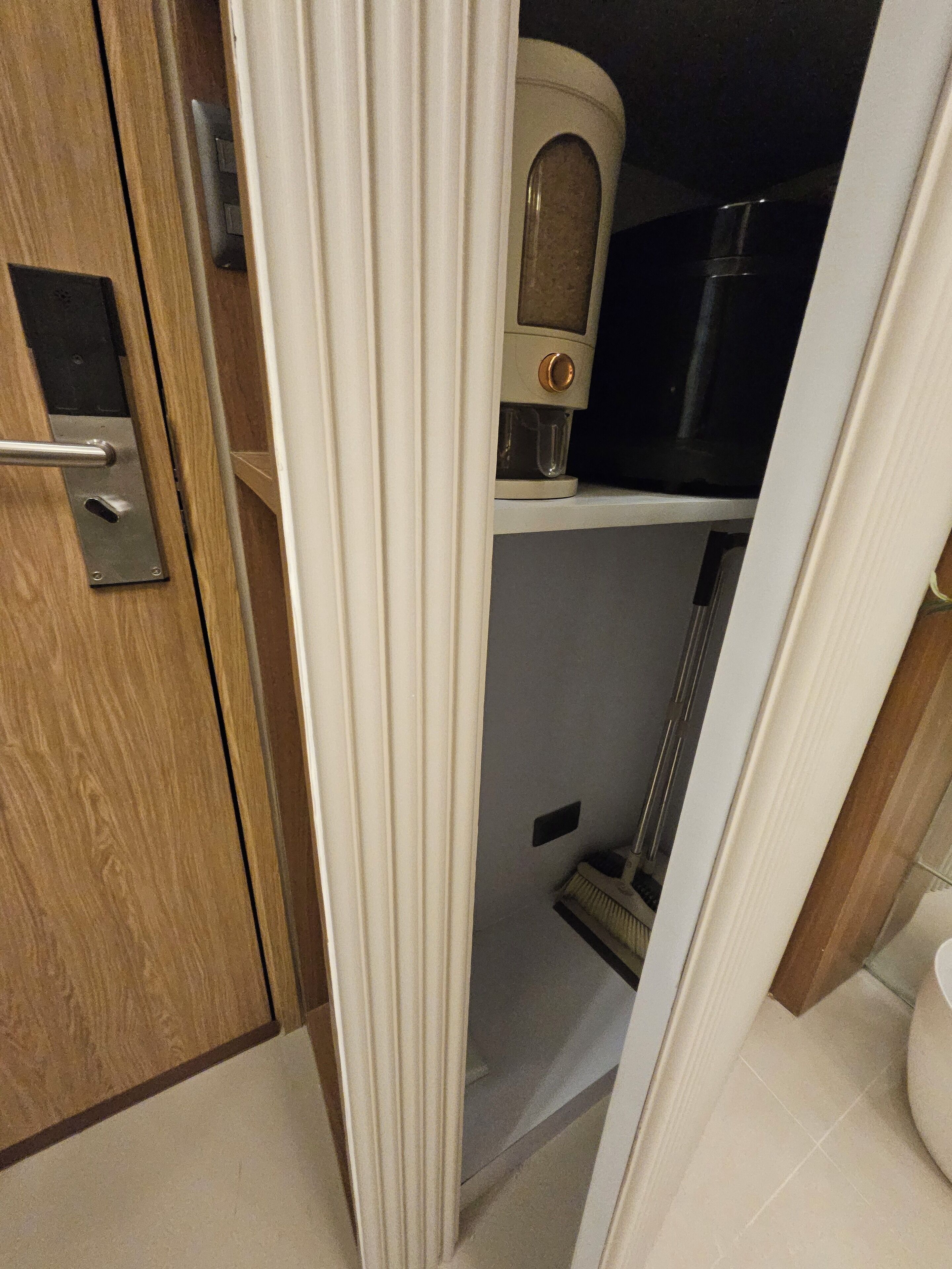 A bathroom with a toilet, a shower, and a sink.