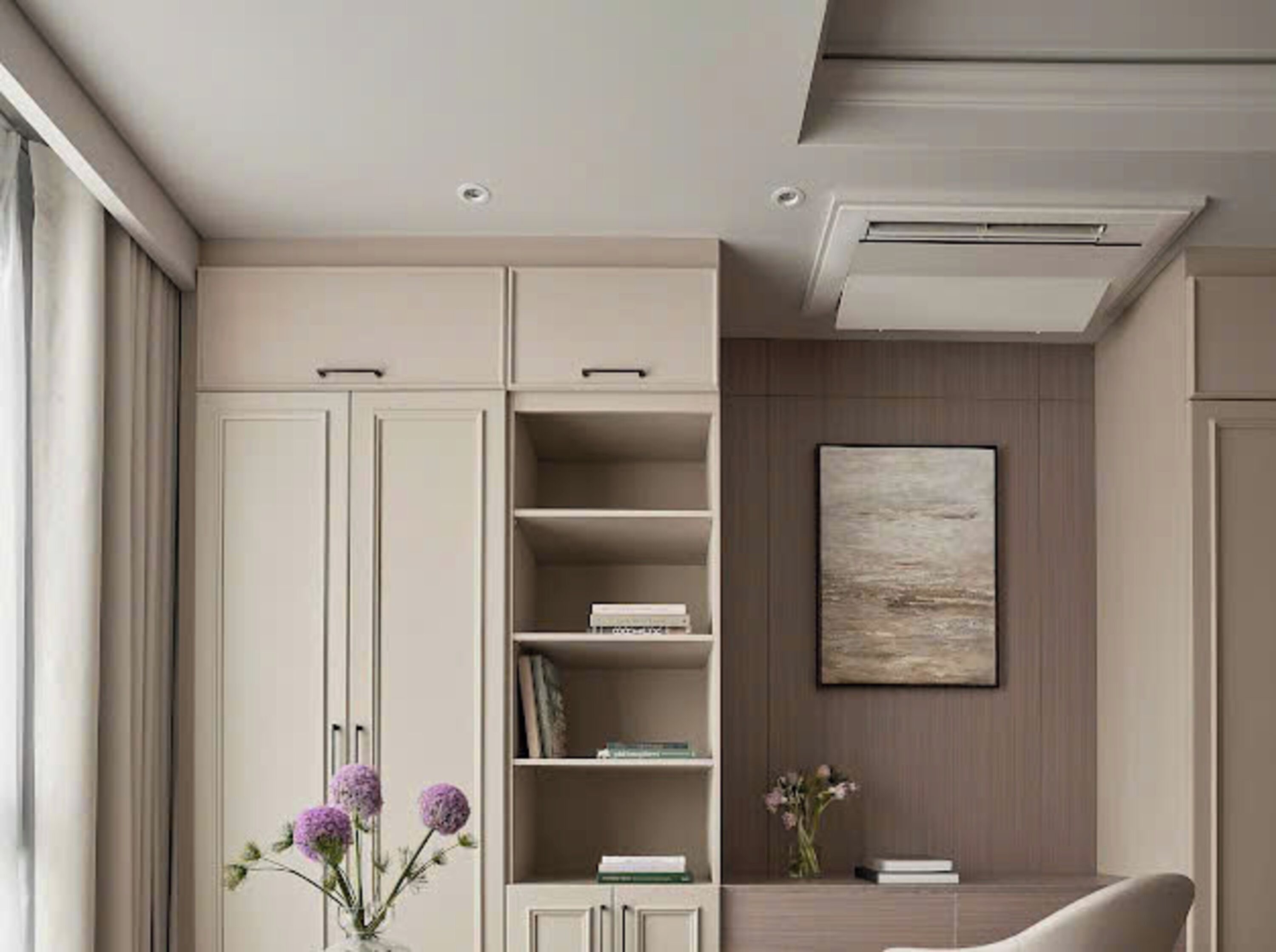 A modern living room with a large cabinet, a mounted artwork, and a vase with flowers.