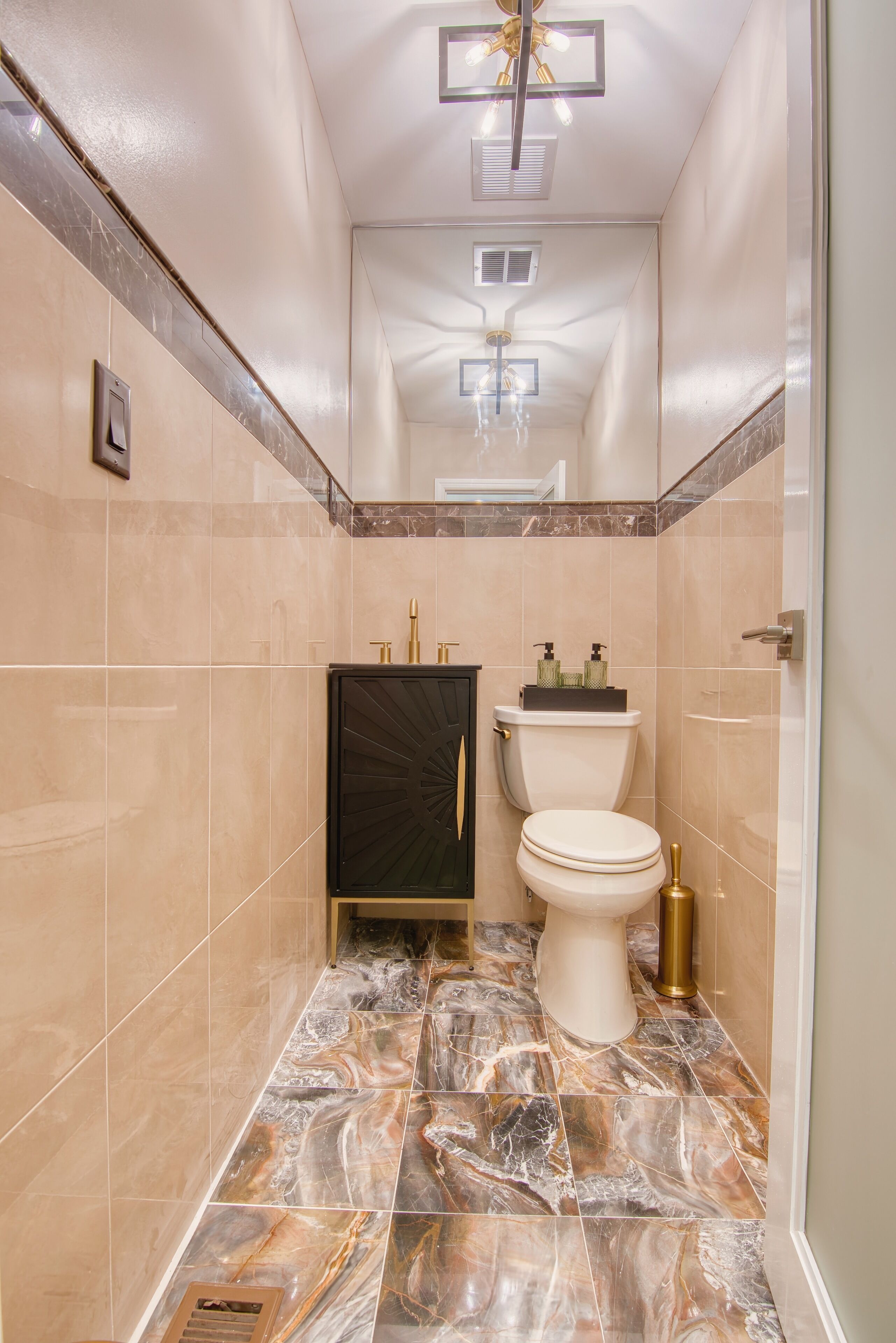 A bathroom with a toilet, bidet, and vanity.