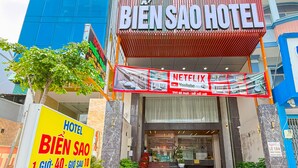 The exterior of the Bien Sao Hotel with a modern facade, large glass windows, and a prominent entrance. - Bien Sao Hotel Duong Quang Ham (Ho Chi Minh City)