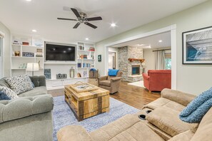 TV, fireplace, books