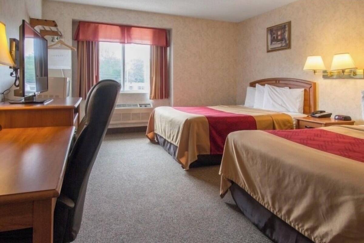 Desk, laptop workspace, blackout curtains, iron/ironing board