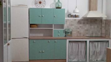 Fridge, microwave, stovetop, coffee/tea maker