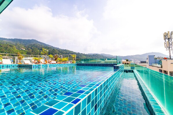 Outdoor pool, open 8:30 AM to 10:30 PM, pool umbrellas, pool loungers