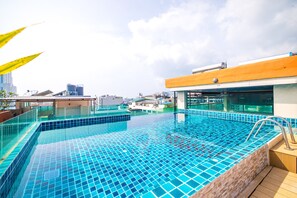Outdoor pool, open 8:30 AM to 10:30 PM, pool umbrellas, pool loungers