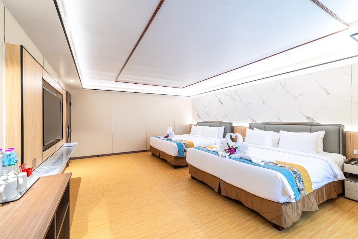 Family Twin Room, 2 Queen Beds, Mountain View | Hypo-allergenic bedding, down duvets, in-room safe, desk