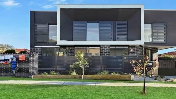 A modern two-story building with a flat roof, large windows, and a brick facade. - Luxury Private Room For Rent (Sydney)