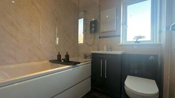 Shower, hair dryer, towels, soap