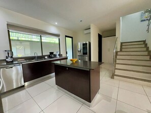Fridge, microwave, oven, stovetop - Exceptional three-bedroom, two-and-a-half-bathroom ground floor condo (Playa Hermosa)