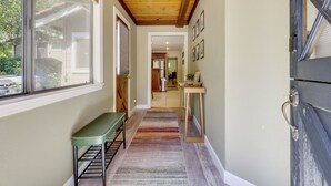 A hallway with a bench, a wooden ceiling, and a door with a window. - Boat Ramp + Dock: Waterfront Home on Clear Lake (Kelseyville)