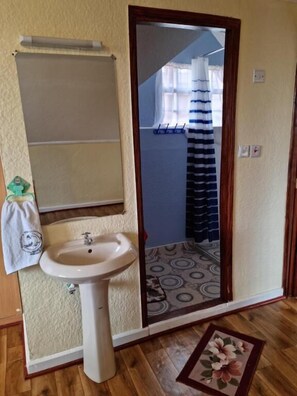 Shower, free toiletries, slippers, towels