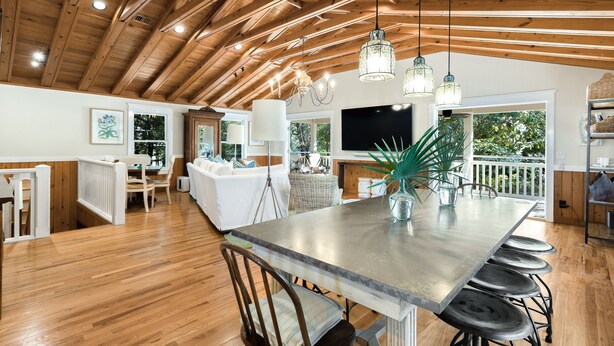 A spacious kitchen with a large island, wooden ceiling, and hanging pendant lights. - Old Seagrove "Angel's Share" 4BR | Sleeps 10 | Heated Pool | Updates | 🐶 (Santa Rosa Beach)