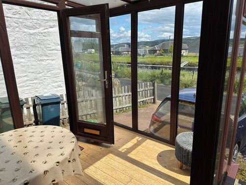 Family Cottage by the Crinan Canal, handy for whisky, golf and standing stones.