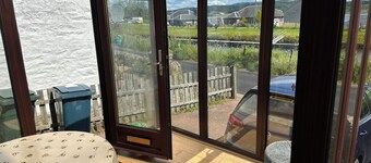 Family Cottage by the Crinan Canal, handy for whisky, golf and standing stones.