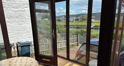 Family Cottage by the Crinan Canal, handy for whisky, golf and standing stones.