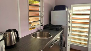 Fridge, microwave, stovetop, cookware/dishes/utensils